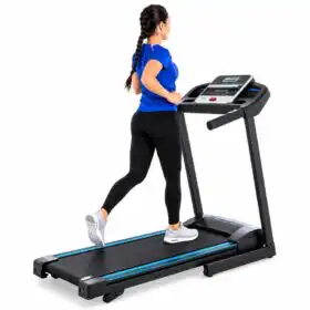 Athletic Woman Running on Modern Treadmill